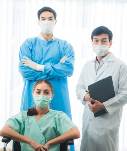 The doctor team take a medical care and treatment to contagious disease patient with the vaccine and drug by using face mask and PPE protection at the health care hospital